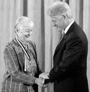 Receiving an award from President Clinton