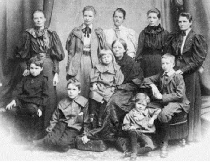 With other members of the Boole familyBack row: Margaret Taylor; Ethel L Voynich; Alicia Boole Stott; Lucy E Boole; Mary E HintonSeated: Julian Taylor; Mary Stott; Mary Everest Boole; George HintonIn front: Geoffrey Ingham Taylor; Leonard Stott
